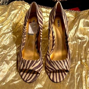 Animal print, brown, cream, gold fabric has a sueded finish